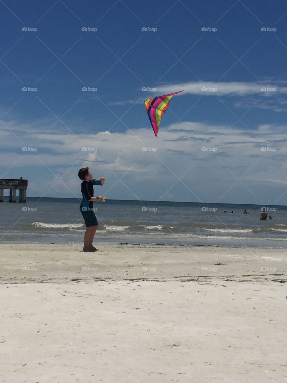 Flying a kite at the beach