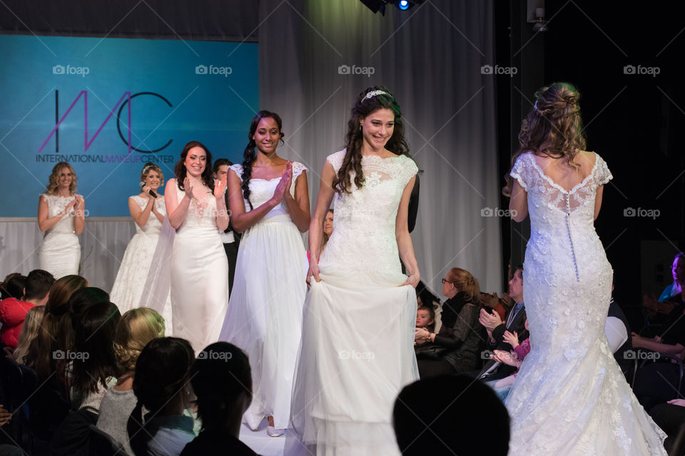Fashion show at a wedding fair. Here are the latest dresses and clothes for both bride and groom