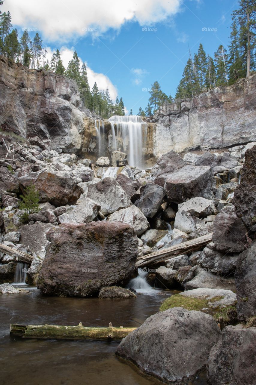 Paulina Falls over the rocky ledge in Oregon