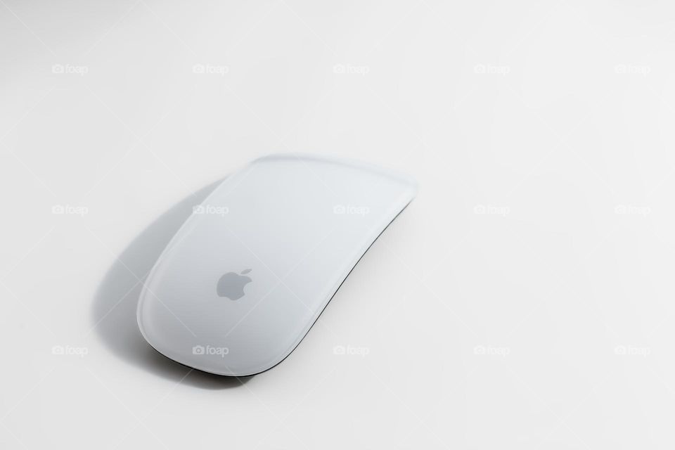 Apple Mac Magic Mouse on white background with slight shadow