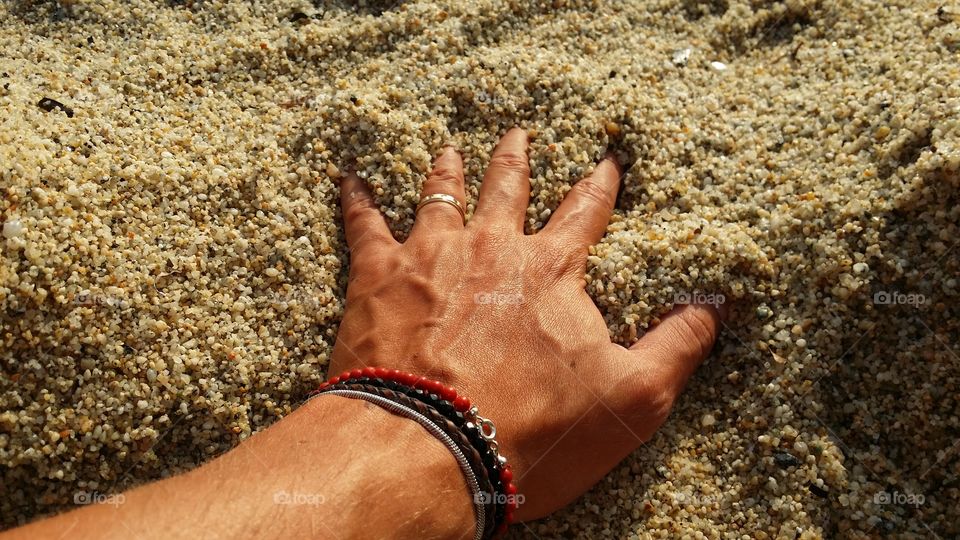 Hand into the sand. in capo vaticano beach