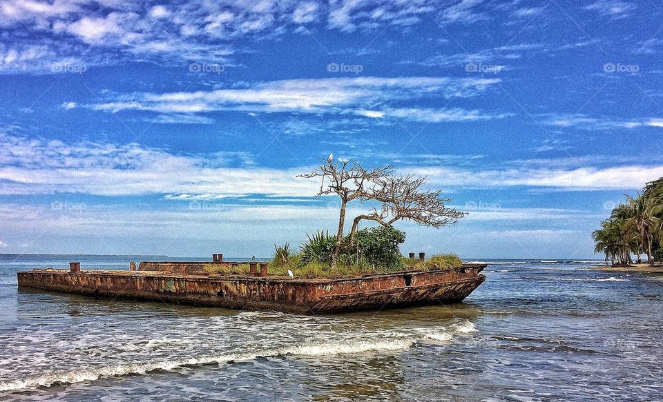 Wrecked ship against sky