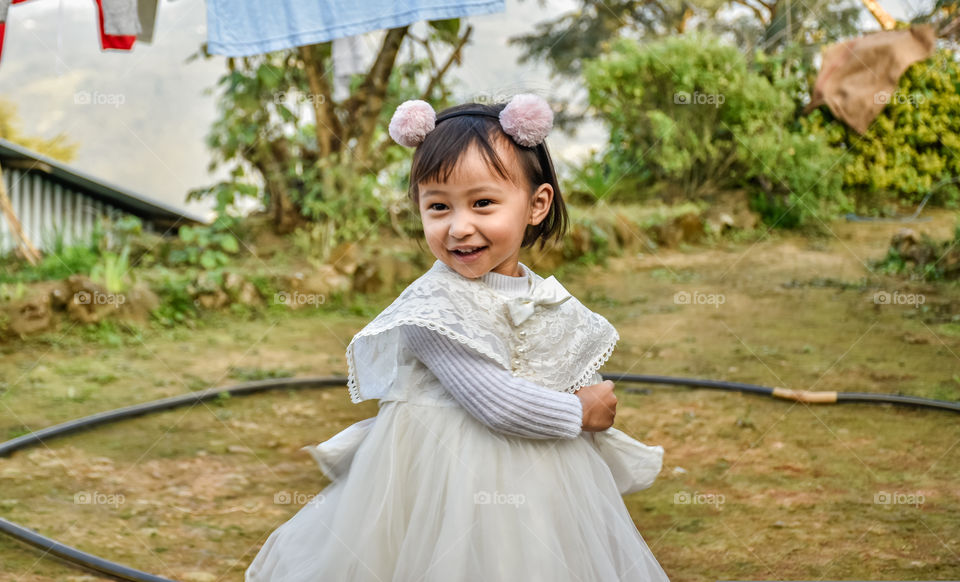 Wearing her favourite dress certainly makes her happy and go all smiles