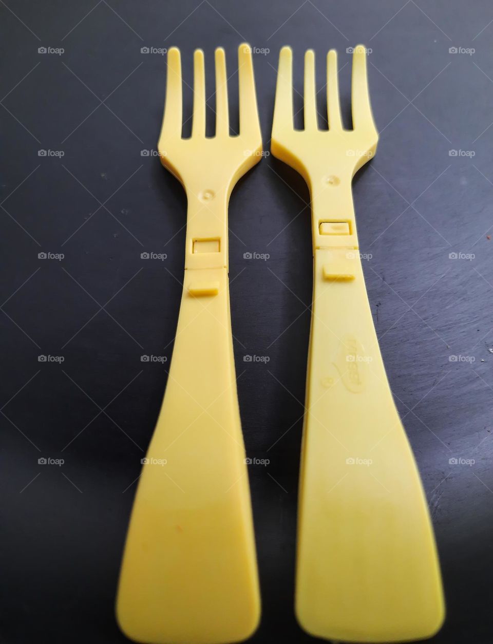 Yellow Forks on a black background