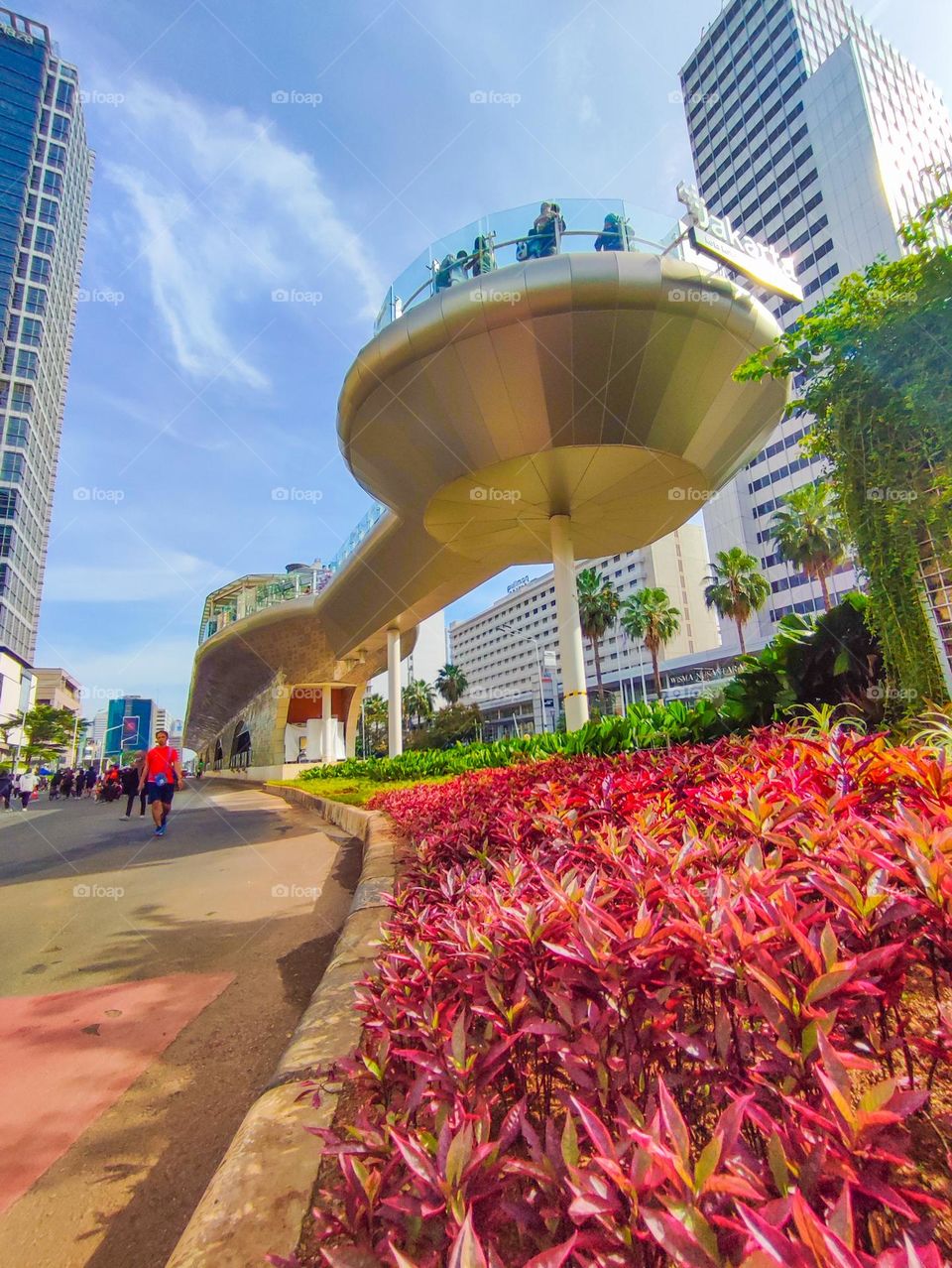 View of the HI Roundabout Bus Stop Building in Central Jakarta at noon.  This bus stop has just been built and will be inaugurated in 2022. The HI Roundabout bus stop is built to look like a ship with a platform for residents to take pictures to enjo