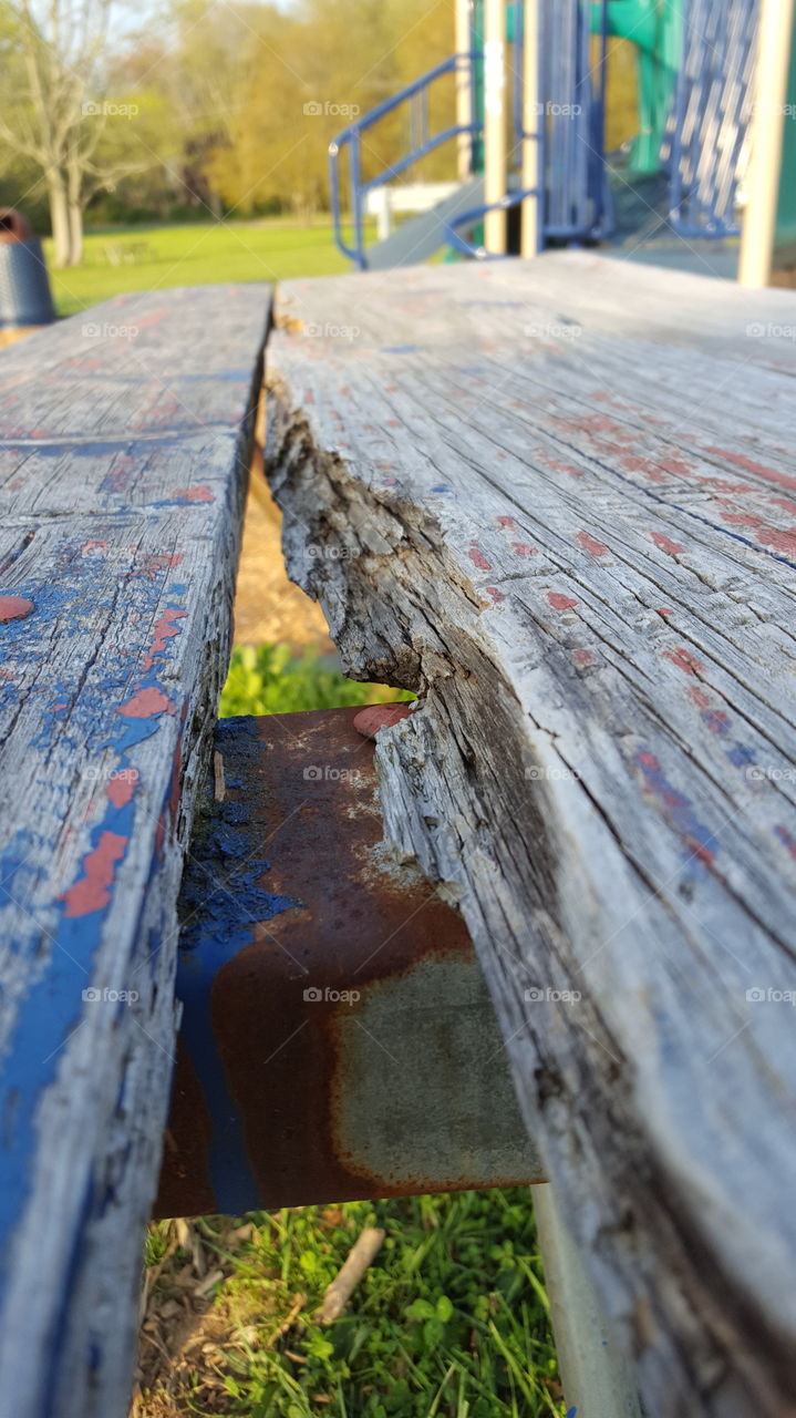 Old broken wooden picnic table
