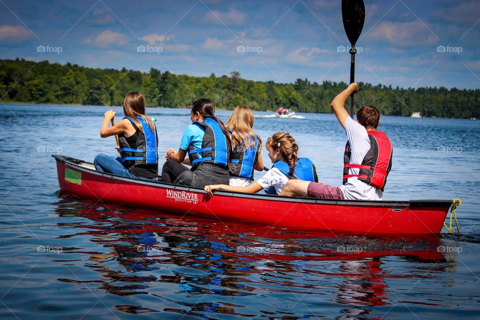 Group of young people in a canoe