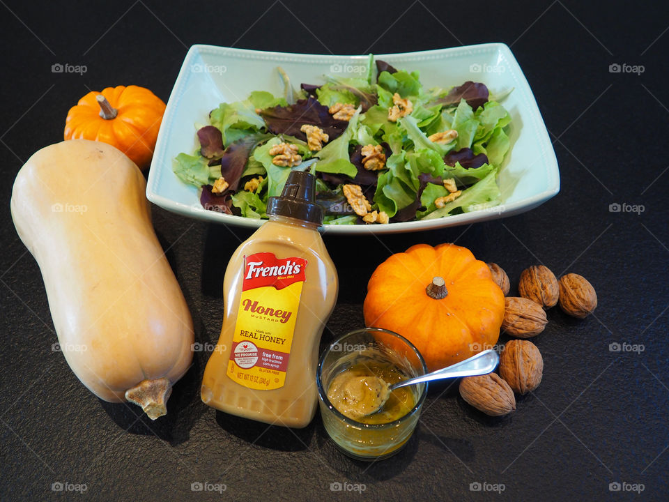 Fresh mixed green salad with walnuts and a French’s mustard vinaigrette.