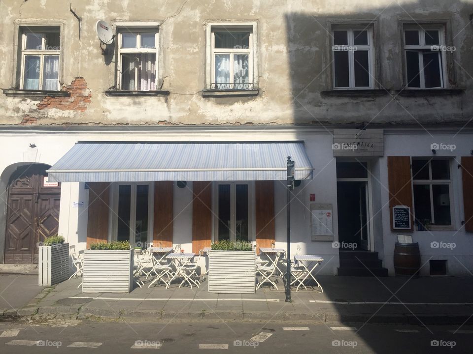 A modern white restaurant in an old building