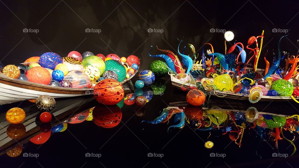 Two canoes with Chihuly bobbers