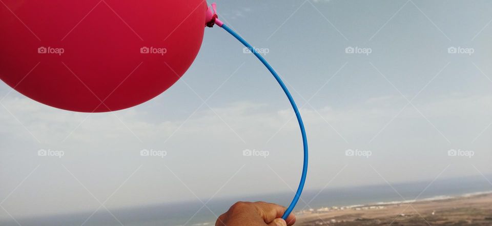 Splendid red ballon and fantastic view to sea.