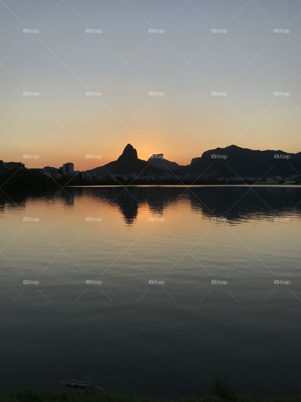 It’s look like a mirror, but it’s just the reflection of the mountains in the Rodrigo de Freitas lagoon. Incredible sunset. Lagoa Rodrigo de Freitas, Rio de Janeiro, Brazil.