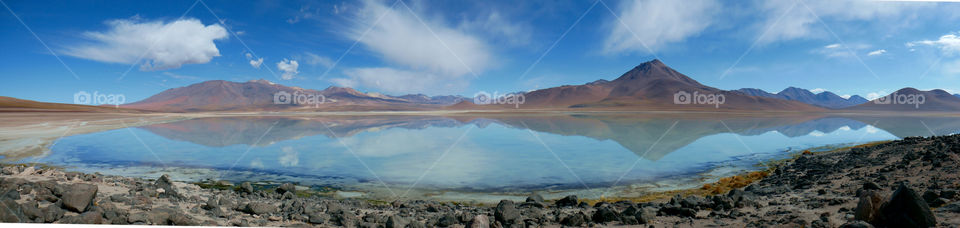 A beautiful pristine lake with georgeous reflectio n in Salar de Uyuni, Bolivia