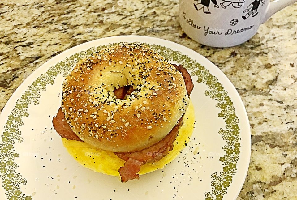 Spam and egg with American cheese on an everything bagel 
