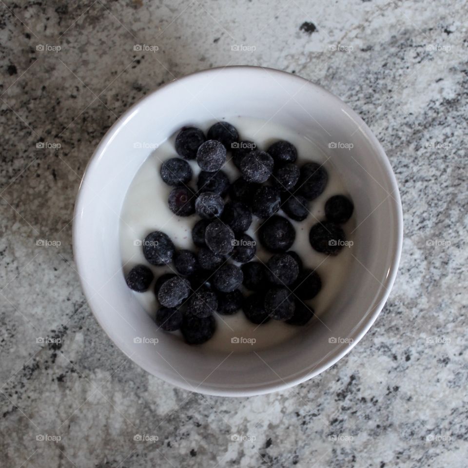 Blueberries with yogurt in bowl
