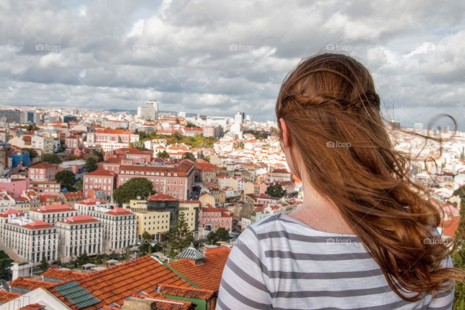 Woman looking at over lisbon 