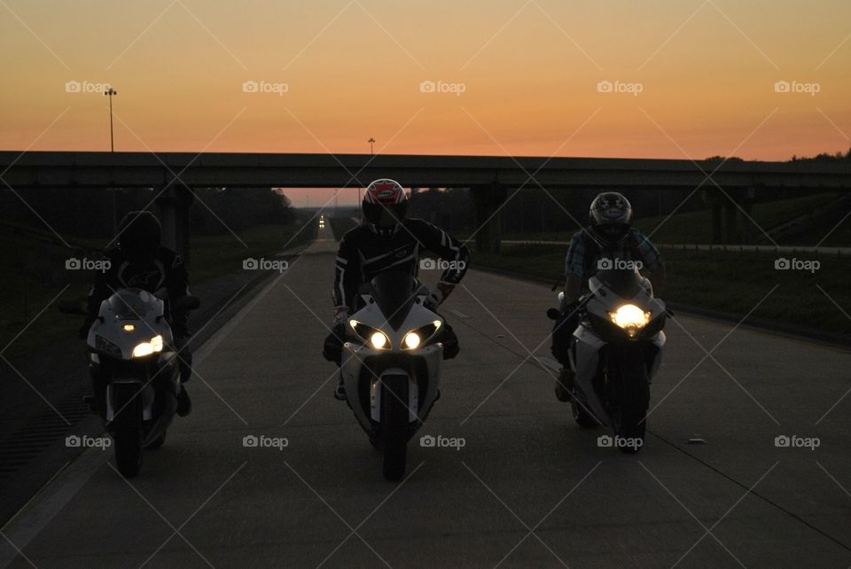 Riding motorcycles at night.