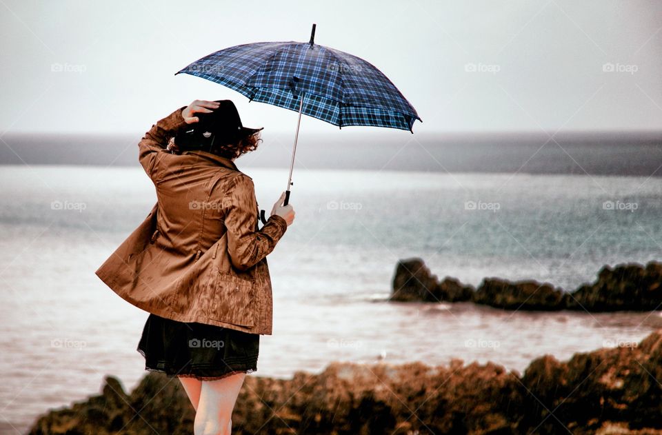 the girl with brown jacket