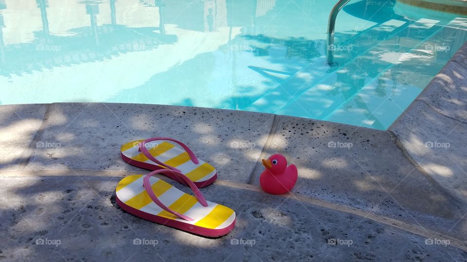 Flip flops and a pink duck