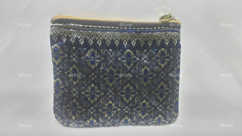 A small pouch bag ( hand made) by Class4569. Material: woven syntetic silk from Thailand. Shop it now! :-)