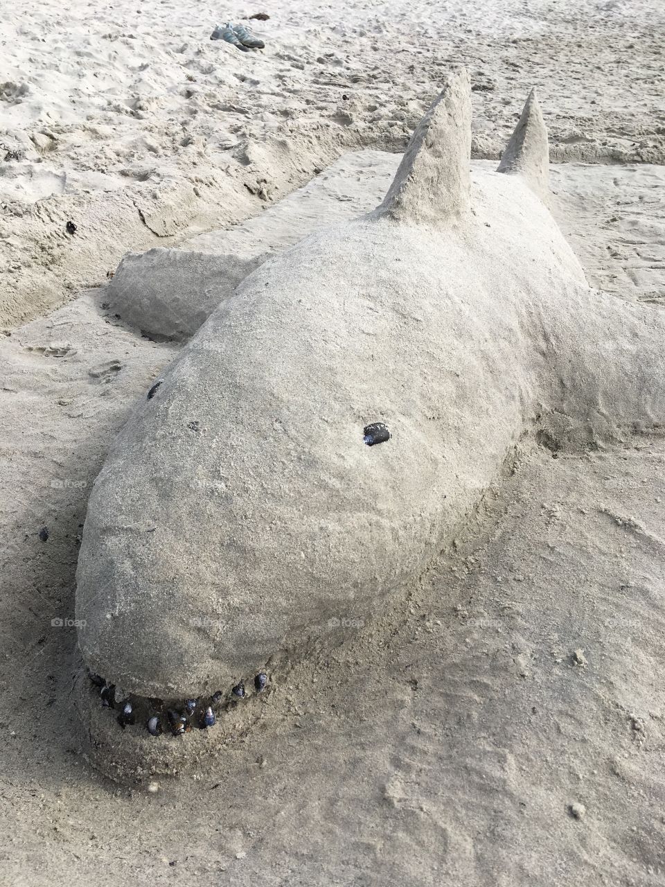 Beach art, sculpture.