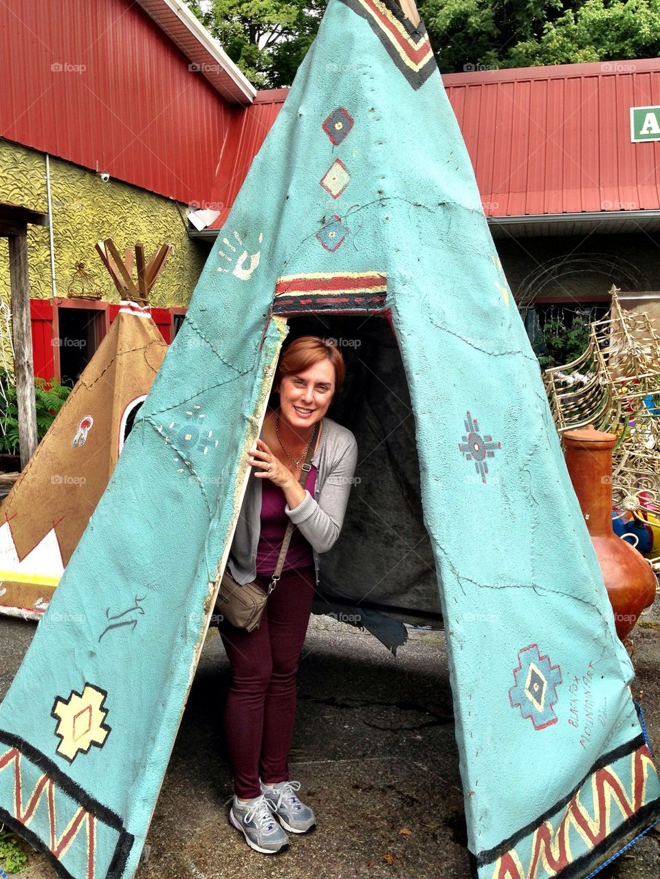 Woman inside a teepee in the street