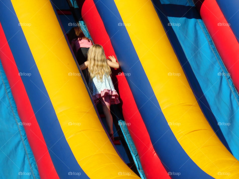 hurry up. This is a picture of some kiddos climbing up a slide at the Oct festival. 👣 🚶 🏃 🔥 💨