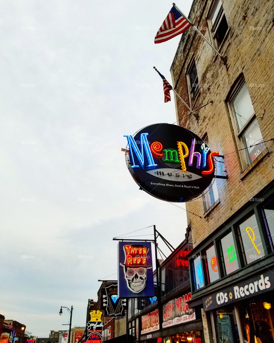 Colorful neon signs along historic old buildings on Beale Street in Memphis Tennessee