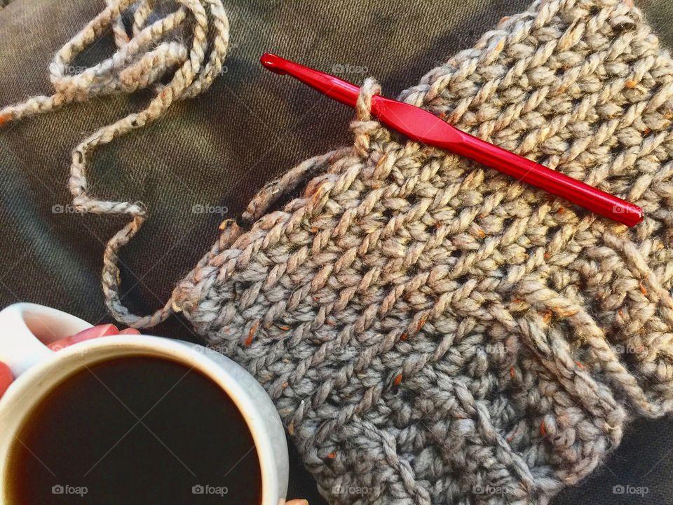 Coffee cup with knitting needle