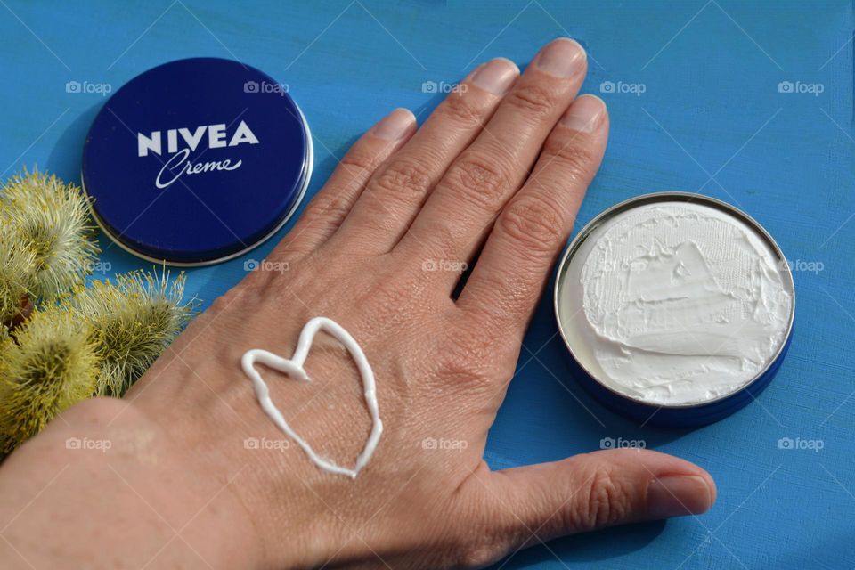 Nivea cream and female hand love Nivea brand