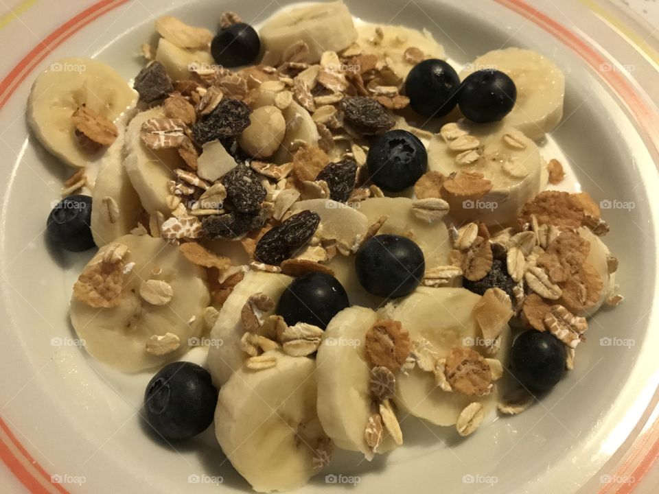 My healthy breakfast. Yoghurt with banana, blueberries and crunch.