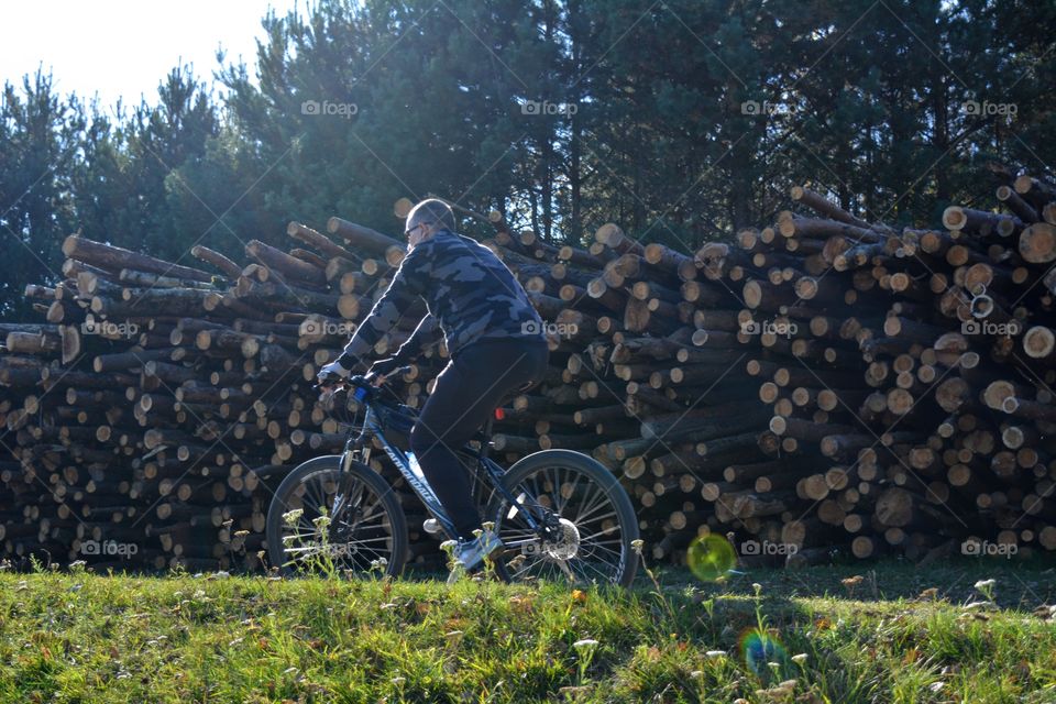 men riding on a bike autumn beautiful landscape