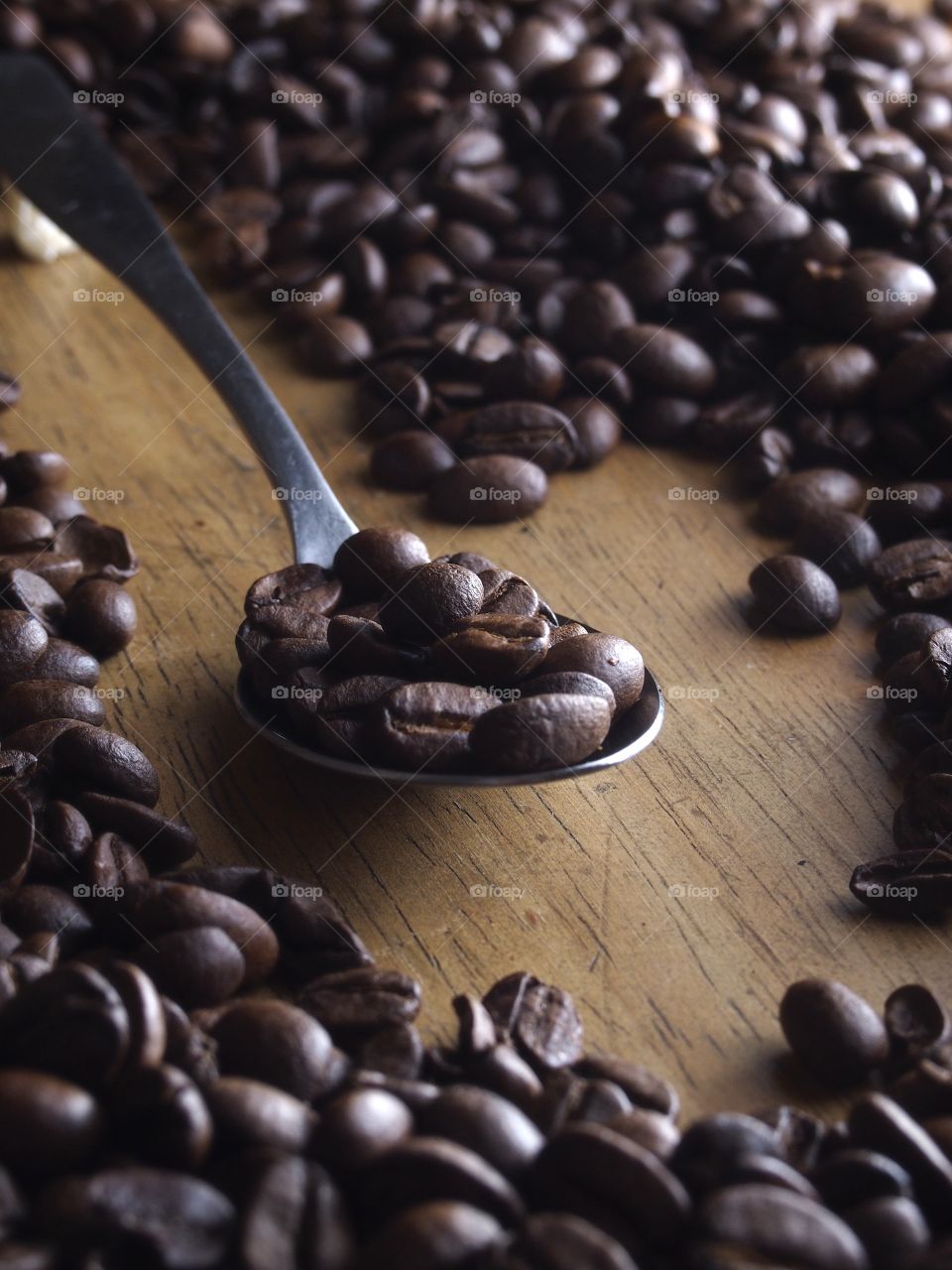 coffee beans on a spoon. coffee beans on a spoon