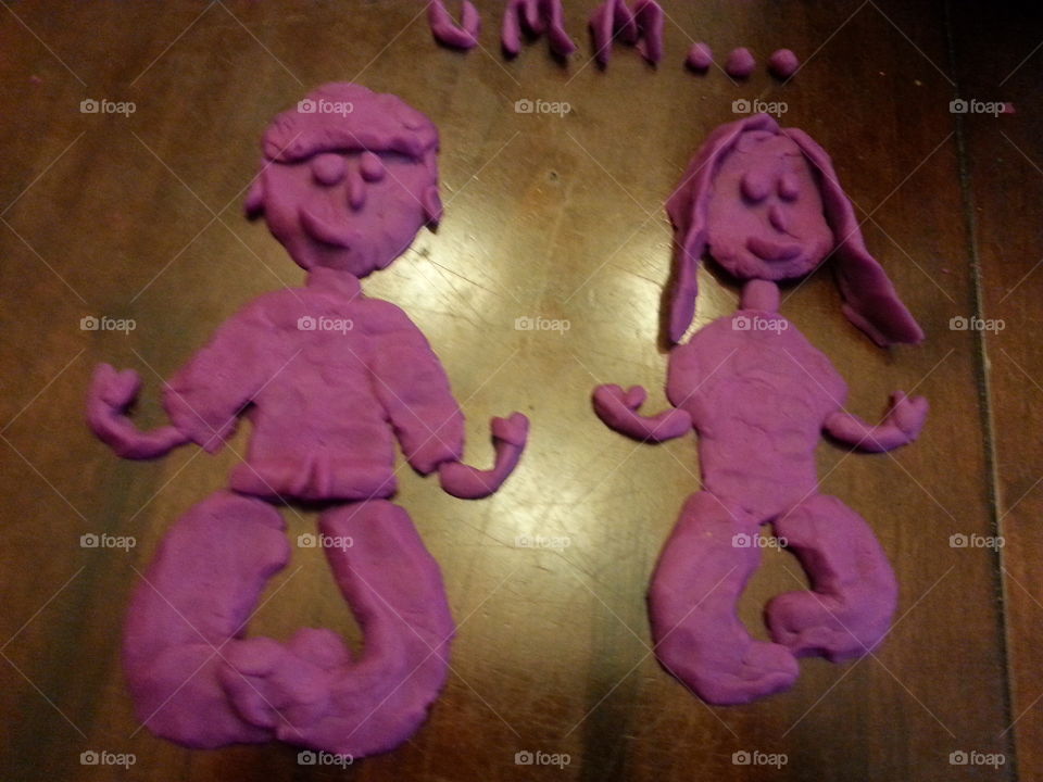 Pink play dough figures . Yoga poses.