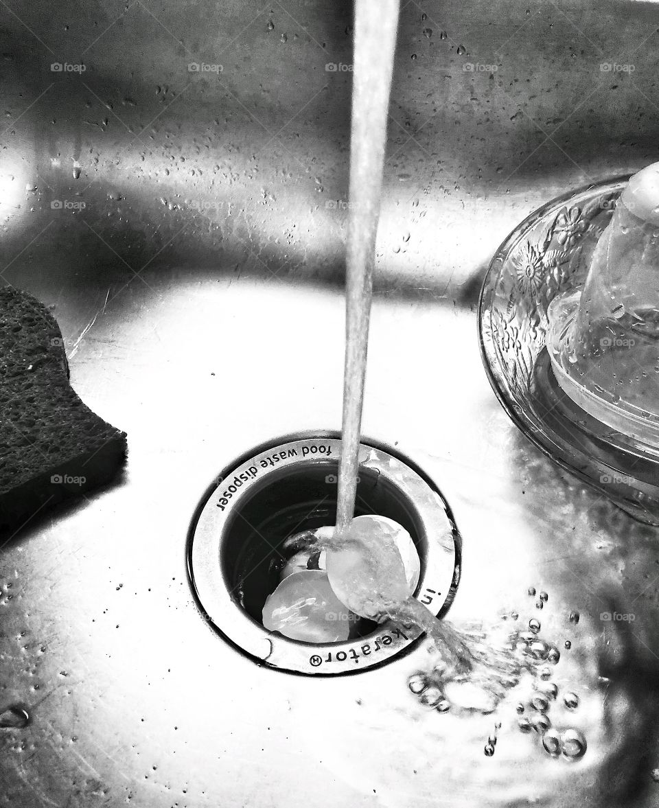 Cleaning up dishes using  garbage disposal 