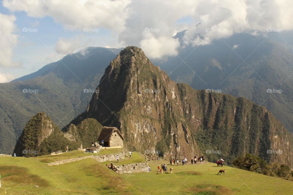 Clouds over Machu Picchu in Peru. Panoramic view over the ancient Inca citadel.