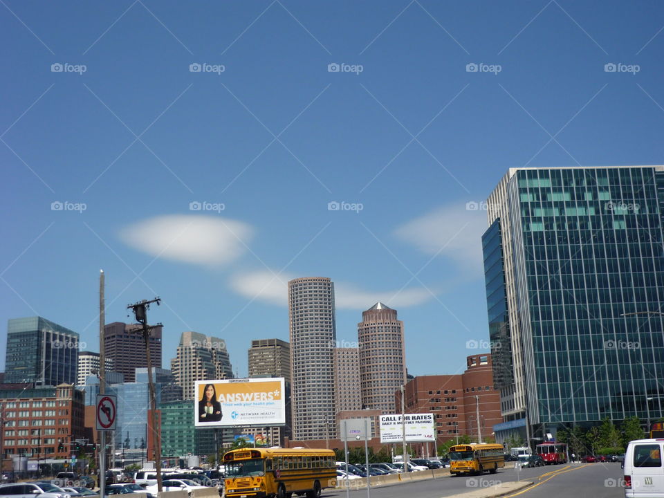 Smiling clouds behind buildings in Boston, Ma