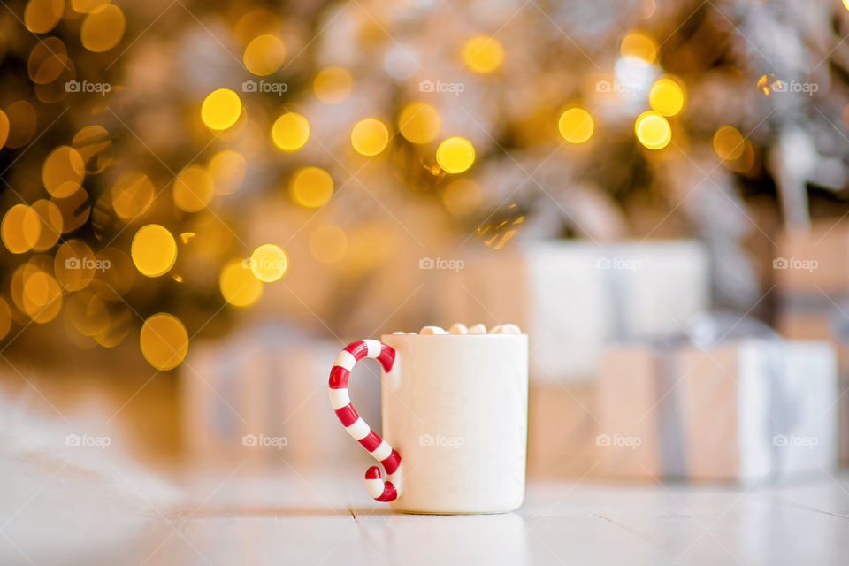 cup of coffee in a cozy festive Christmas atmosphere