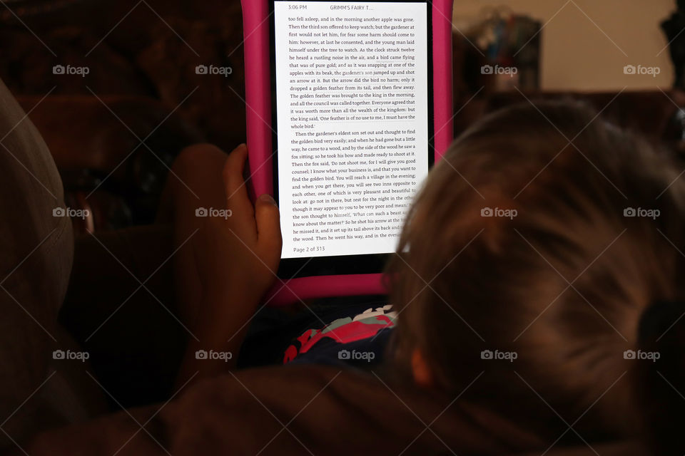 Child reading on a tablet