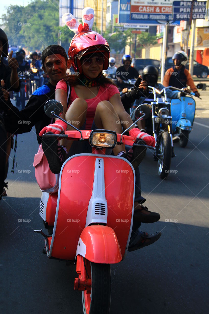 A Vespa fan girl in Makassar, South Sulawesi, Indonesia, joined the convoy on October 24, 2018, to celebrate Youth Oath Day