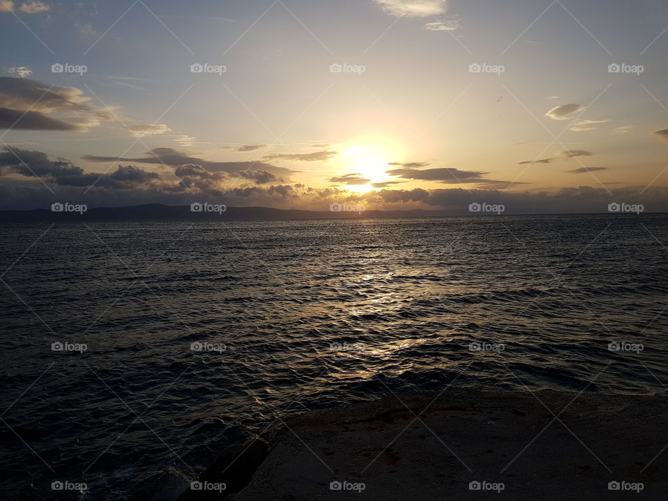 combination of sun and clouds