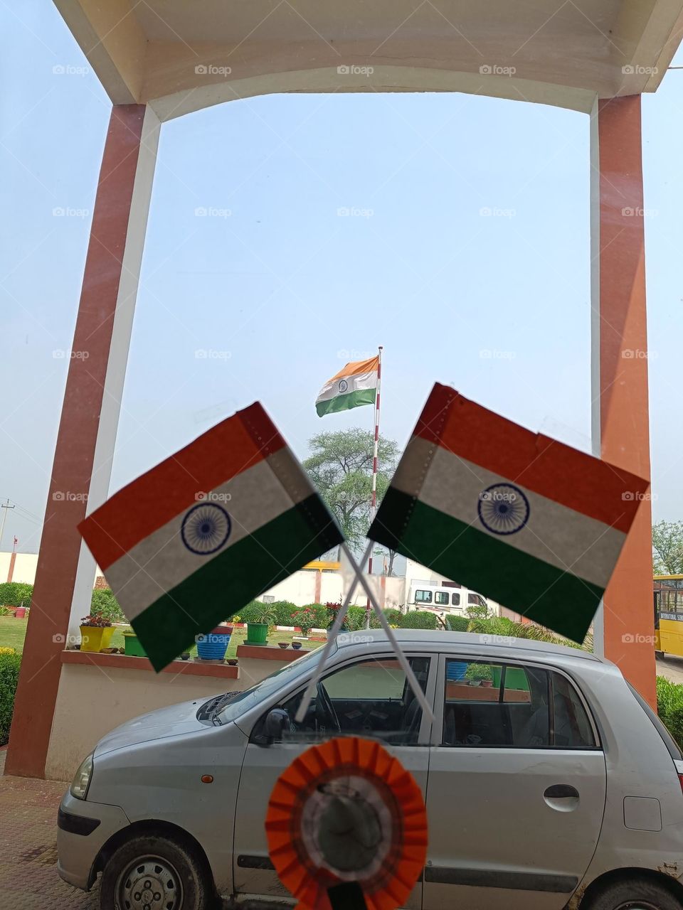 a photo of Indian national flag through two indian national flag.