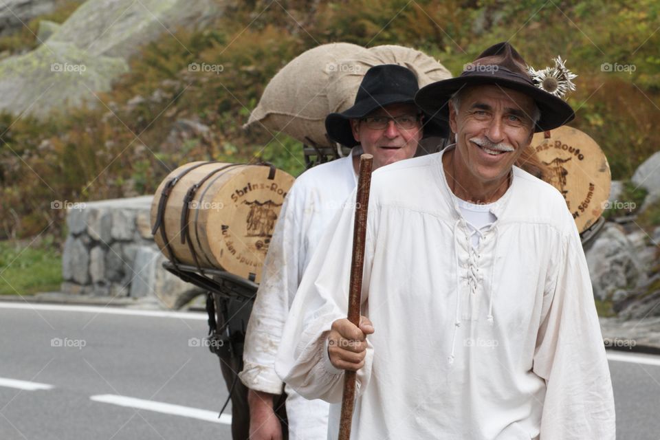 Mountain Men Leading Mules On The Swiss Alps