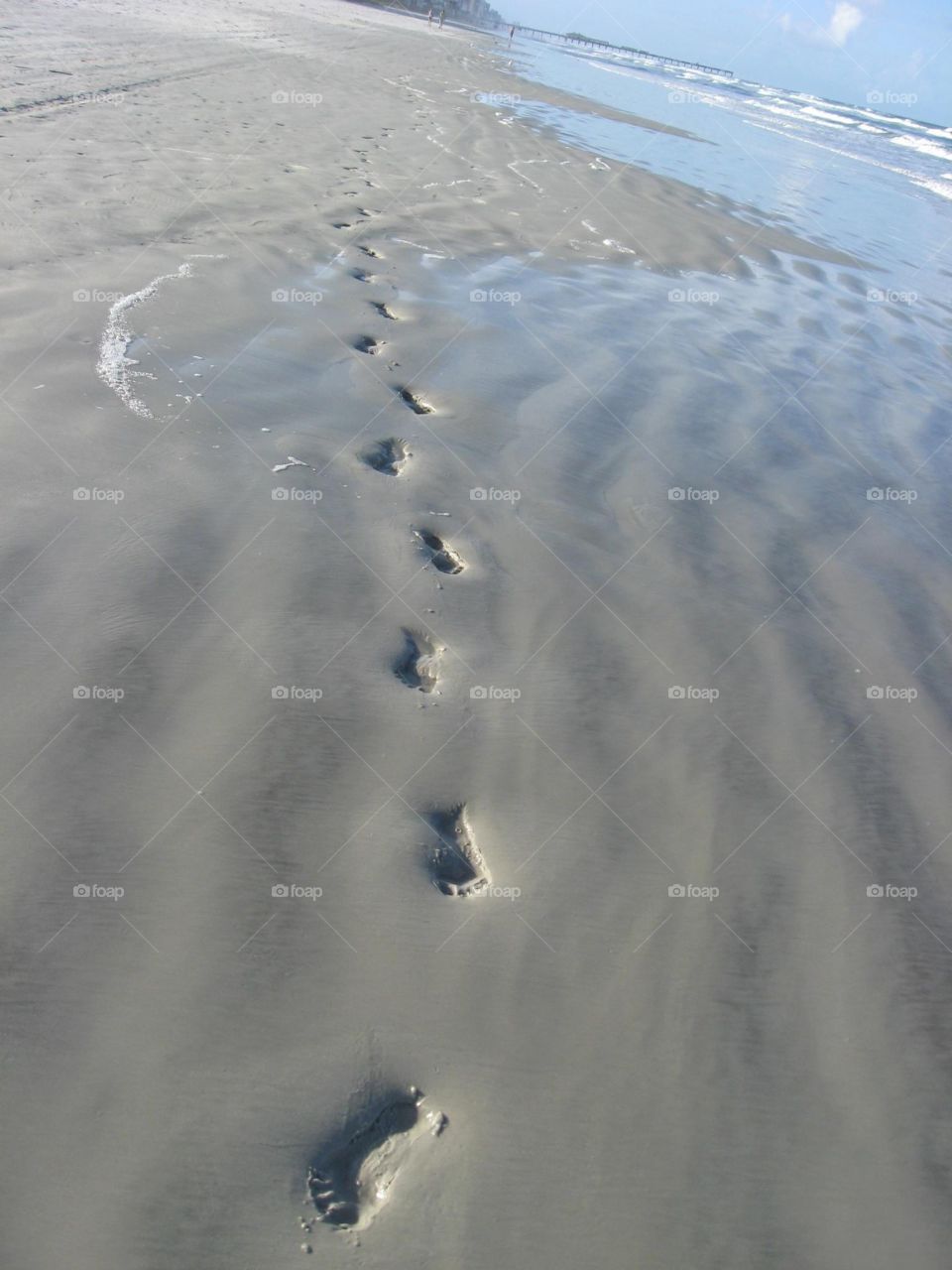 Footprint in sand on beach