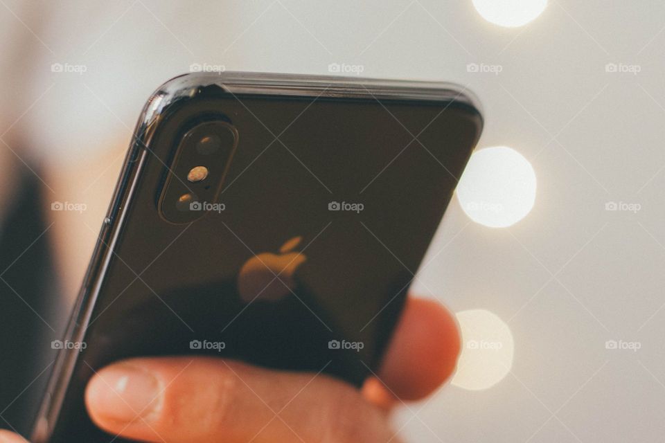 person holding jet black iPhone X