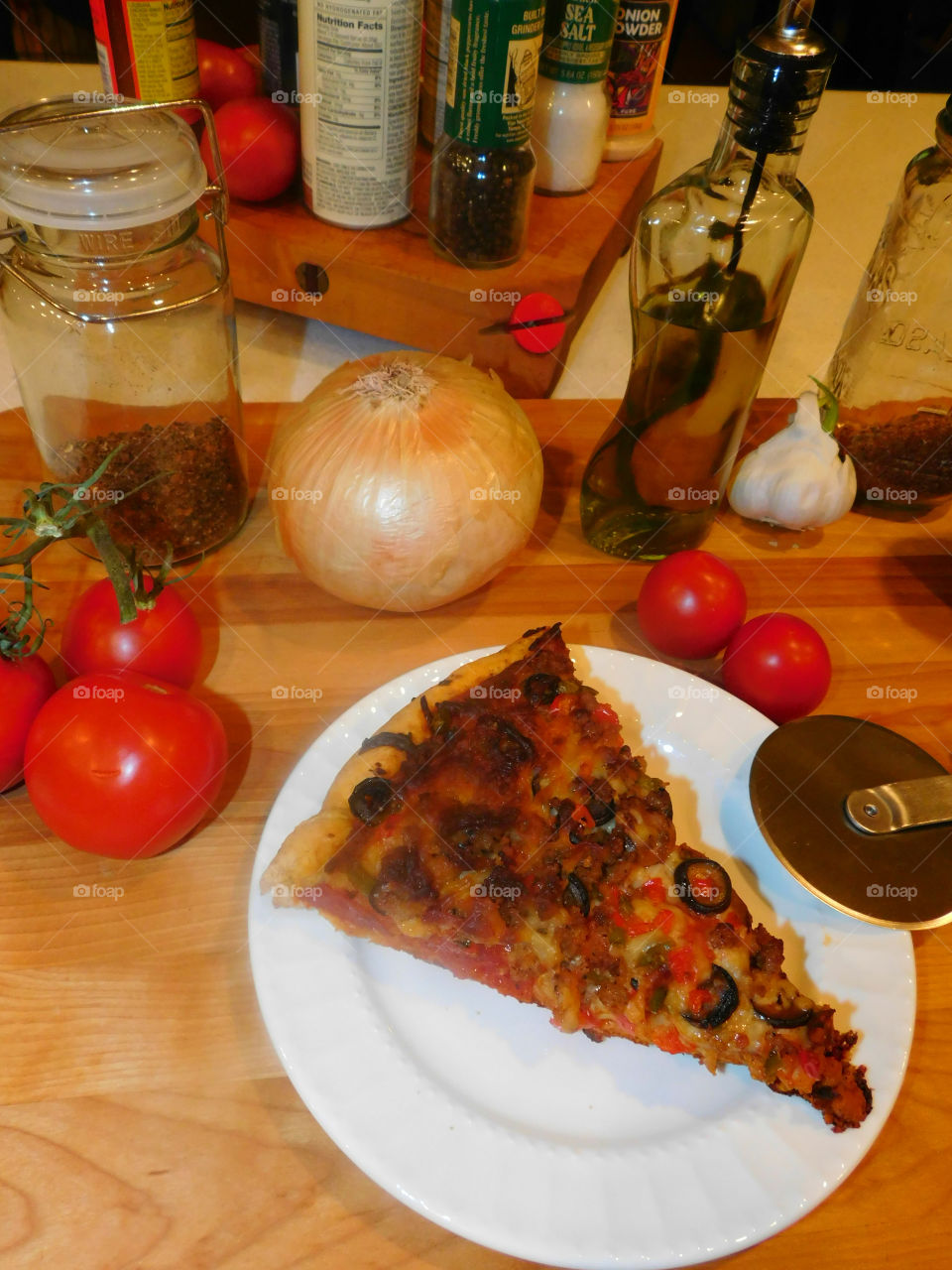 Delicious and nutritious homemade pizza with fresh, colorful vegetables, meats and a variety of spices! Grab a slice!