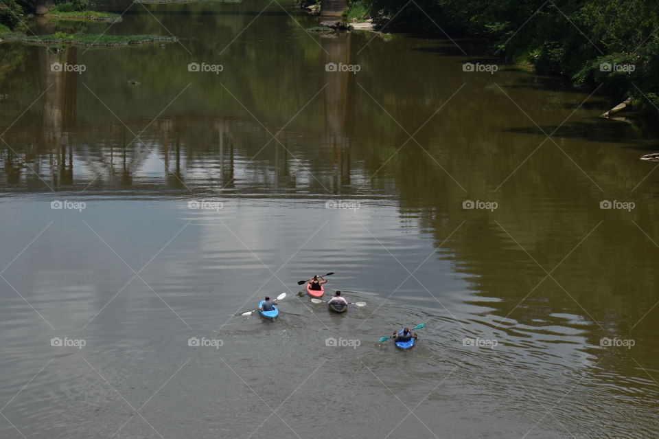 people kayaking on the river