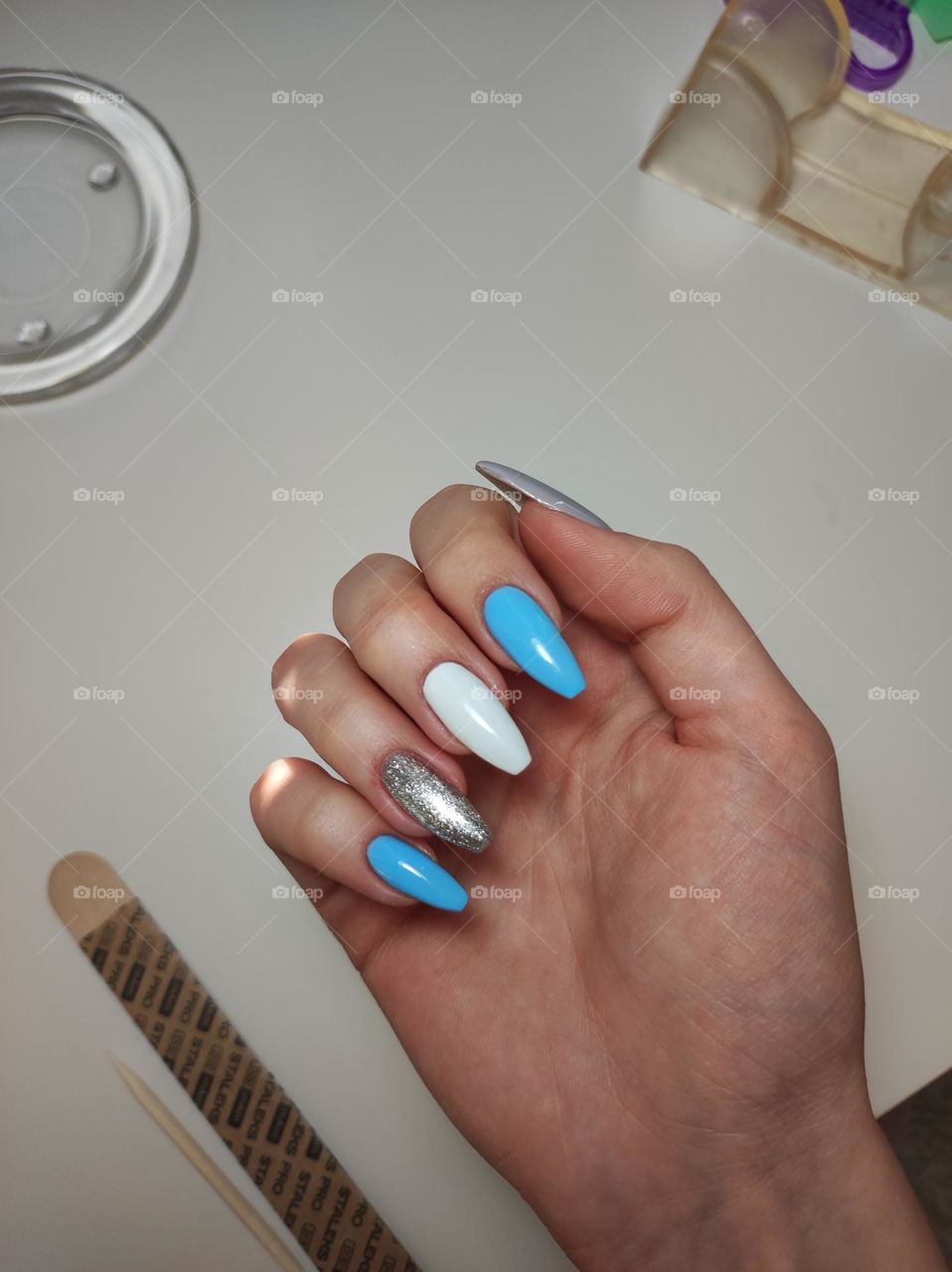 Gel nail manicure with blue, white and silver polish/ Beautiful polish on nails/ Naturally long nails with gel nail polish/ Colourful nails
