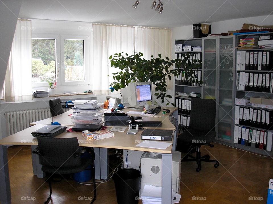 Office room with furniture and documents