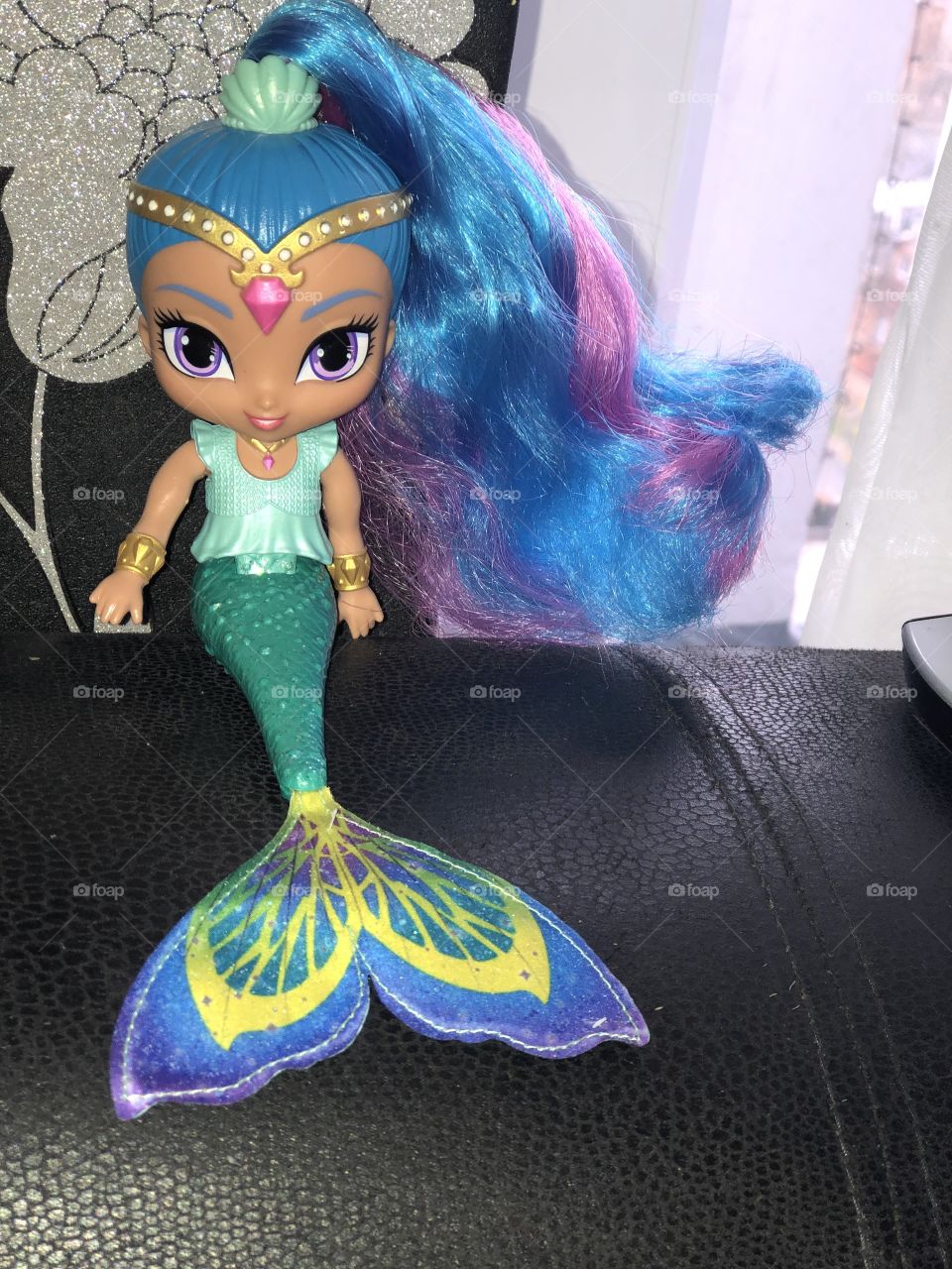 My daughter first ever doll, lovely mermaid and very colourful, good to play in the bath with.